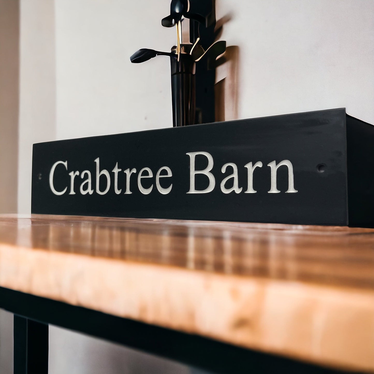 Introducing our stunning 30cm x 5cm Polished Natural Slate House Sign, designed to make a lasting impression! Crafted with durability in mind, it features beautifully carved lettering that enhances its elegance and visibility. Transform your home's entrance with this exquisite sign! www.HouseSign.co.uk