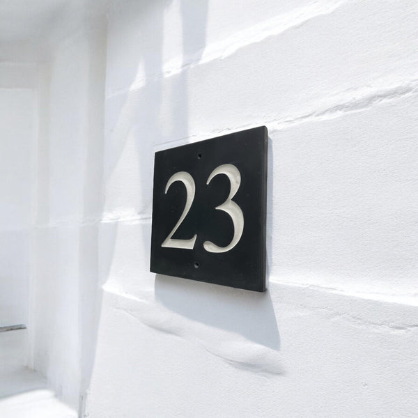 Introducing our stunning 10cm x 10cm Polished Natural Slate House Sign, designed to make a lasting impression! Crafted with durability in mind, it features beautifully carved lettering that enhances its elegance and visibility. Transform your home's entrance with this exquisite sign! www.HouseSign.co.uk