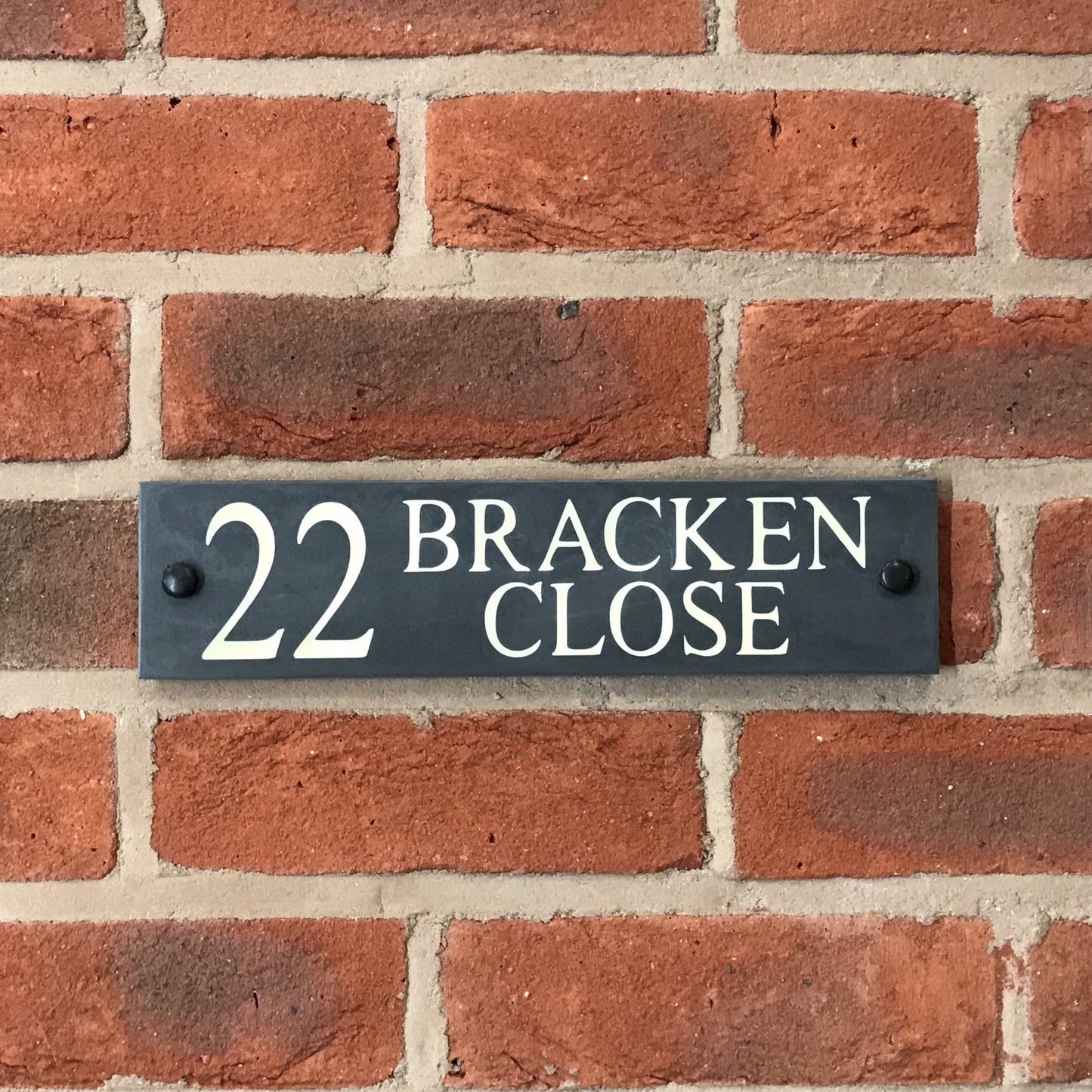 Introducing our stunning 30cm x 7.5cm Polished Natural Slate House Sign, designed to make a lasting impression! Crafted with durability in mind, it features beautifully carved lettering that enhances its elegance and visibility. Transform your home's entrance with this exquisite sign! www.HouseSign.co.uk