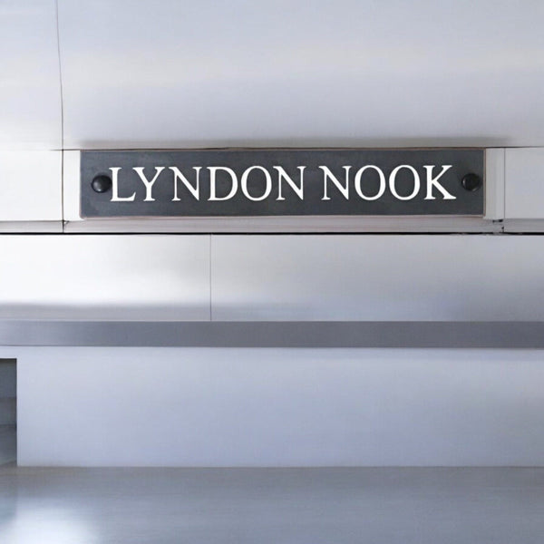 Introducing our stunning 30cm x 5cm Polished Natural Slate House Sign, designed to make a lasting impression! Crafted with durability in mind, it features beautifully carved lettering that enhances its elegance and visibility. Transform your home's entrance with this exquisite sign! www.HouseSign.co.uk