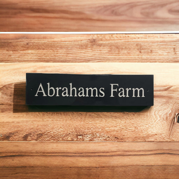 Introducing our stunning 30cm x 5cm Polished Natural Slate House Sign, designed to make a lasting impression! Crafted with durability in mind, it features beautifully carved lettering that enhances its elegance and visibility. Transform your home's entrance with this exquisite sign! www.HouseSign.co.uk
