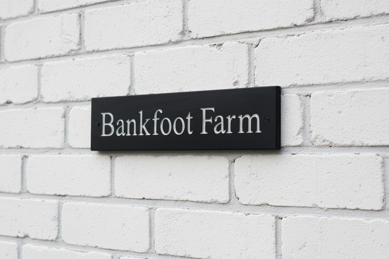 Introducing our stunning 30cm x 5cm Polished Natural Slate House Sign, designed to make a lasting impression! Crafted with durability in mind, it features beautifully carved lettering that enhances its elegance and visibility. Transform your home's entrance with this exquisite sign! www.HouseSign.co.uk