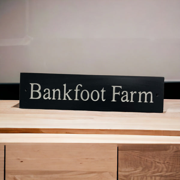Introducing our stunning 30cm x 5cm Polished Natural Slate House Sign, designed to make a lasting impression! Crafted with durability in mind, it features beautifully carved lettering that enhances its elegance and visibility. Transform your home's entrance with this exquisite sign! www.HouseSign.co.uk