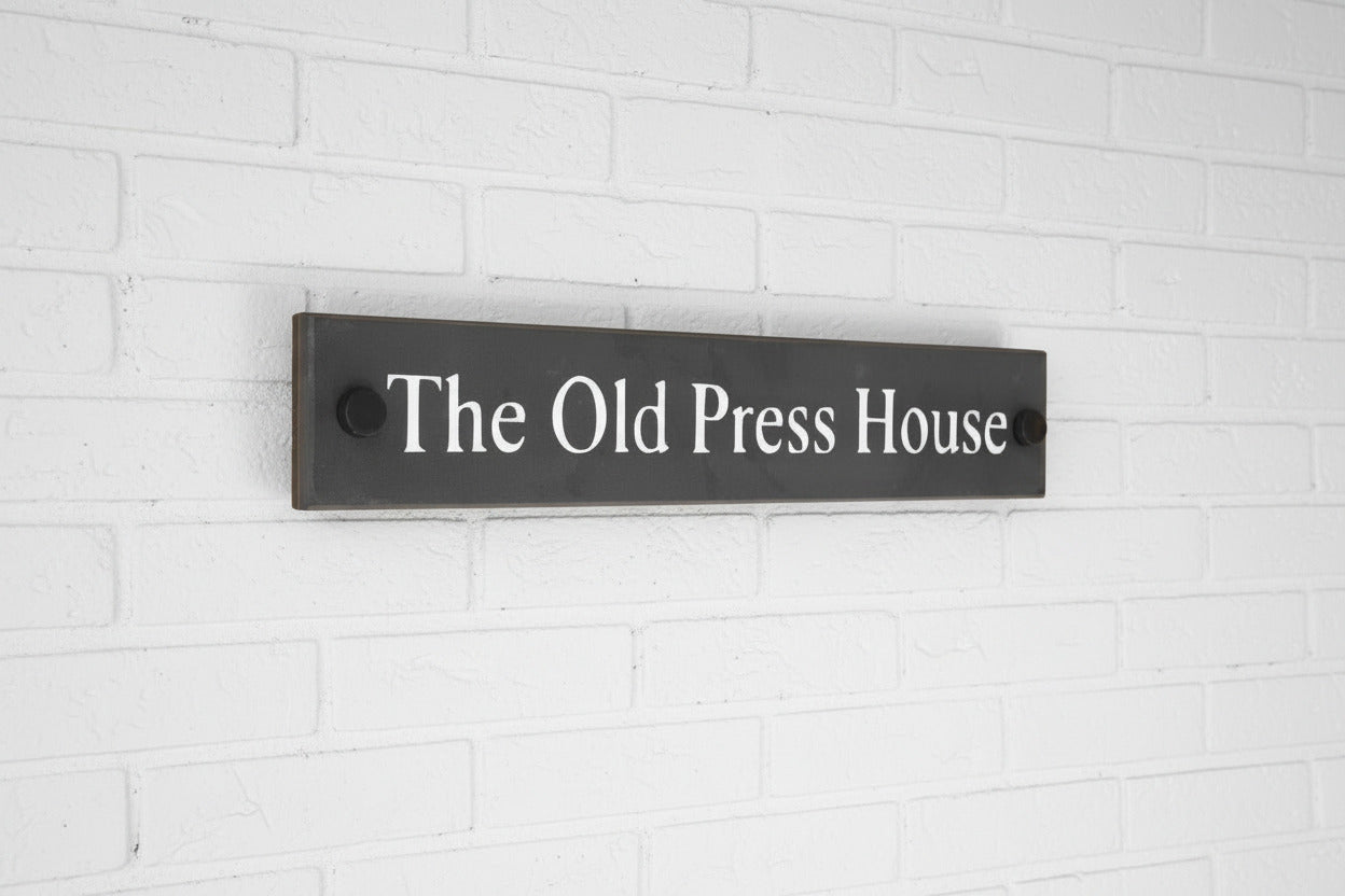 Introducing our stunning 30cm x 5cm Polished Natural Slate House Sign, designed to make a lasting impression! Crafted with durability in mind, it features beautifully carved lettering that enhances its elegance and visibility. Transform your home's entrance with this exquisite sign! www.HouseSign.co.uk