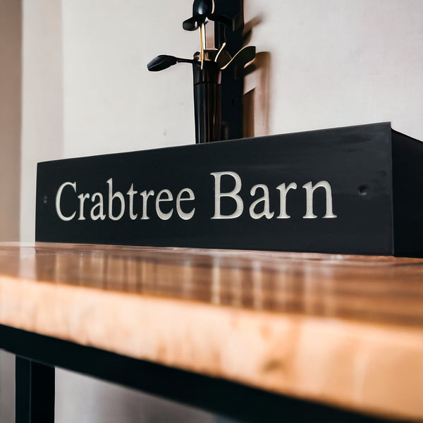 Introducing our stunning 30cm x 5cm Polished Natural Slate House Sign, designed to make a lasting impression! Crafted with durability in mind, it features beautifully carved lettering that enhances its elegance and visibility. Transform your home's entrance with this exquisite sign! www.HouseSign.co.uk