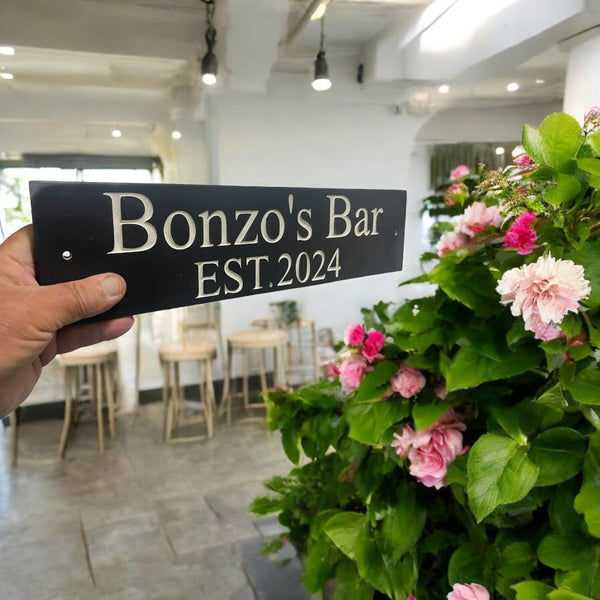 Introducing our stunning 30cm x 7.5cm Polished Natural Slate House Sign, designed to make a lasting impression! Crafted with durability in mind, it features beautifully carved lettering that enhances its elegance and visibility. Transform your home's entrance with this exquisite sign! www.HouseSign.co.uk