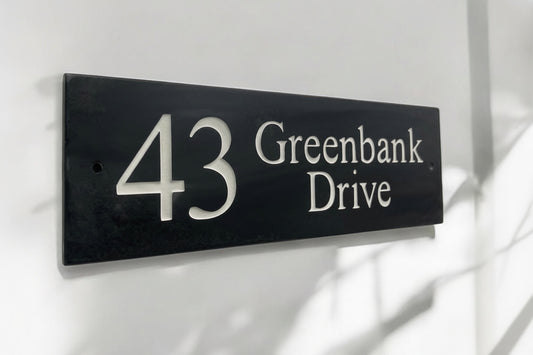 Introducing our stunning 30cm x 10cm Polished Natural Slate House Sign, designed to make a lasting impression! Crafted with durability in mind, it features beautifully carved lettering that enhances its elegance and visibility. Transform your home's entrance with this exquisite sign! www.HouseSign.co.uk