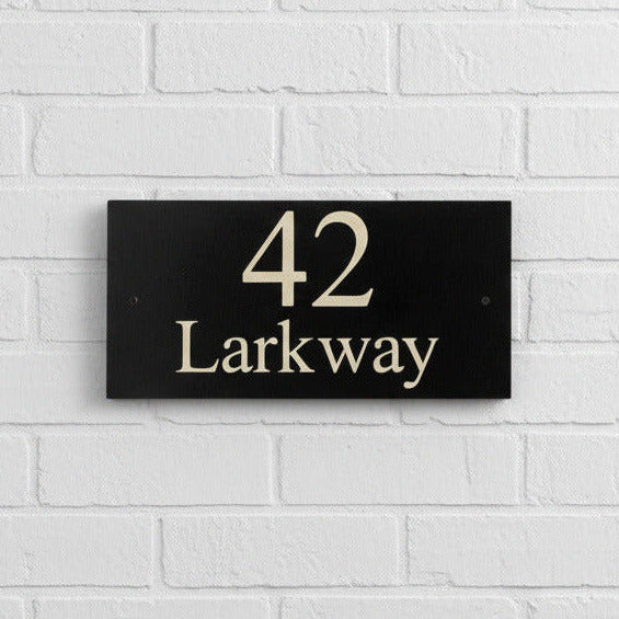 Introducing our stunning 30cm x 15cm Polished Natural Slate House Sign, designed to make a lasting impression! Crafted with durability in mind, it features beautifully carved lettering that enhances its elegance and visibility. Transform your home's entrance with this exquisite sign! www.HouseSign.co.uk