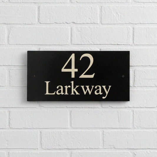 Introducing our stunning 30cm x 15cm Polished Natural Slate House Sign, designed to make a lasting impression! Crafted with durability in mind, it features beautifully carved lettering that enhances its elegance and visibility. Transform your home's entrance with this exquisite sign! www.HouseSign.co.uk