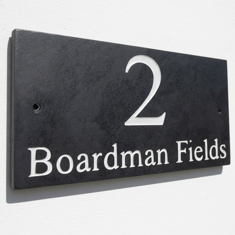 Introducing our stunning 30cm x 15cm Polished Natural Slate House Sign, designed to make a lasting impression! Crafted with durability in mind, it features beautifully carved lettering that enhances its elegance and visibility. Transform your home's entrance with this exquisite sign! www.HouseSign.co.uk