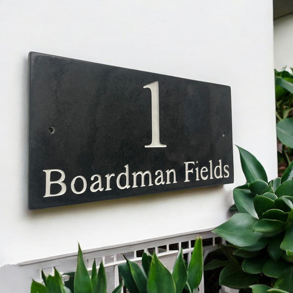 Introducing our stunning 30cm x 15cm Polished Natural Slate House Sign, designed to make a lasting impression! Crafted with durability in mind, it features beautifully carved lettering that enhances its elegance and visibility. Transform your home's entrance with this exquisite sign! www.HouseSign.co.uk