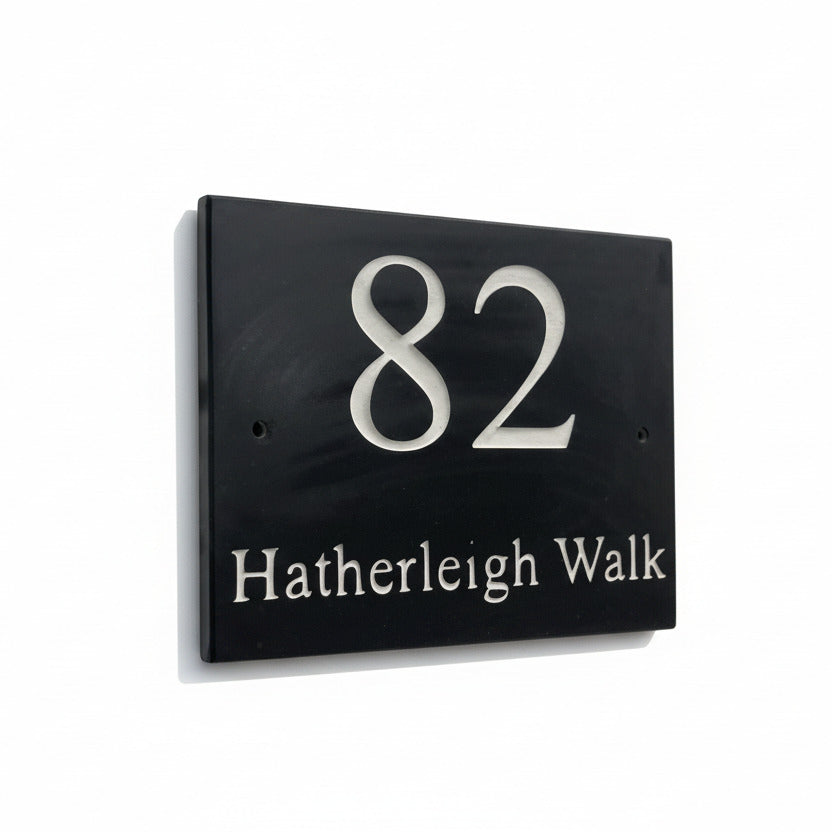 Introducing our stunning 30cm x 20cm Polished Natural Slate House Sign, designed to make a lasting impression! Crafted with durability in mind, it features beautifully carved lettering that enhances its elegance and visibility. Transform your home's entrance with this exquisite sign! www.HouseSign.co.uk