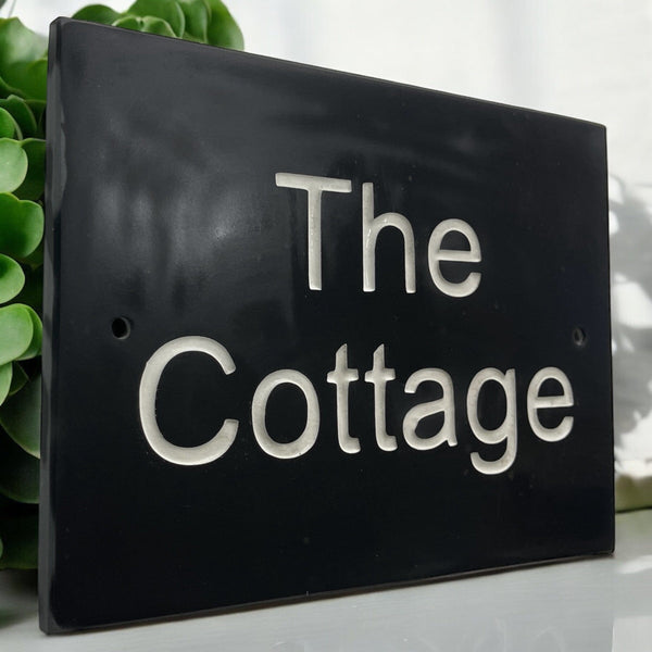 Introducing our stunning 30cm x 20cm Polished Natural Slate House Sign, designed to make a lasting impression! Crafted with durability in mind, it features beautifully carved lettering that enhances its elegance and visibility. Transform your home's entrance with this exquisite sign! www.HouseSign.co.uk