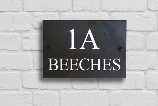 Introducing our stunning 30cm x 20cm Polished Natural Slate House Sign, designed to make a lasting impression! Crafted with durability in mind, it features beautifully carved lettering that enhances its elegance and visibility. Transform your home's entrance with this exquisite sign! www.HouseSign.co.uk