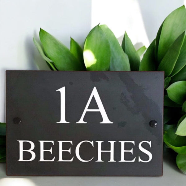 Introducing our stunning 30cm x 20cm Polished Natural Slate House Sign, designed to make a lasting impression! Crafted with durability in mind, it features beautifully carved lettering that enhances its elegance and visibility. Transform your home's entrance with this exquisite sign! www.HouseSign.co.uk