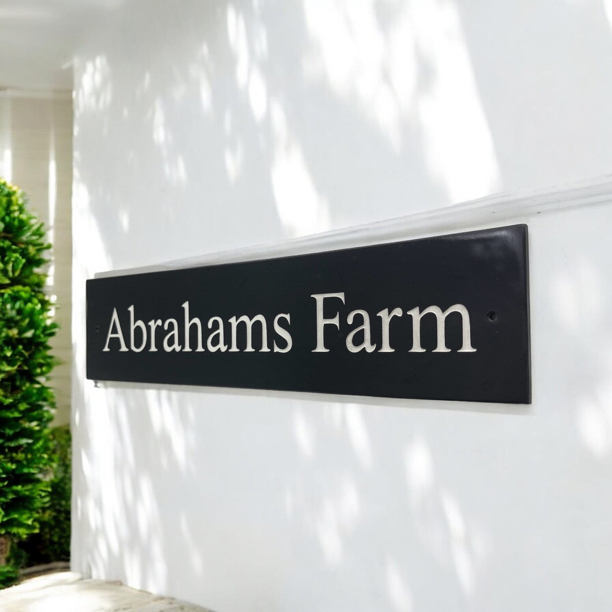 Introducing our stunning 40cm x 7.5cm Polished Natural Slate House Sign, designed to make a lasting impression! Crafted with durability in mind, it features beautifully carved lettering that enhances its elegance and visibility. Transform your home's entrance with this exquisite sign! www.HouseSign.co.uk