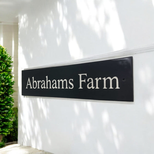 Introducing our stunning 40cm x 7.5cm Polished Natural Slate House Sign, designed to make a lasting impression! Crafted with durability in mind, it features beautifully carved lettering that enhances its elegance and visibility. Transform your home's entrance with this exquisite sign! www.HouseSign.co.uk
