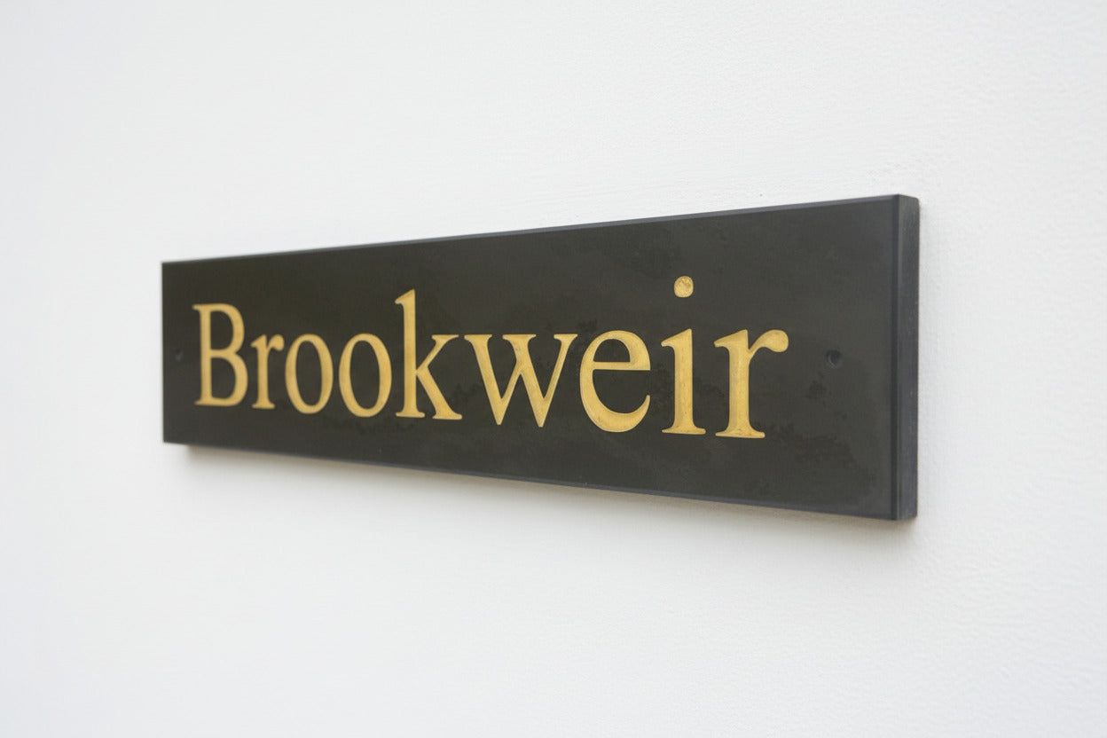 Introducing our stunning 40cm x 10cm Polished Natural Slate House Sign, designed to make a lasting impression! Crafted with durability in mind, it features beautifully carved lettering that enhances its elegance and visibility. Transform your home's entrance with this exquisite sign! www.HouseSign.co.uk