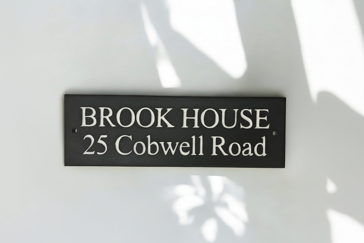 Introducing our stunning 41cm x 15cm Polished Natural Slate House Sign, designed to make a lasting impression! Crafted with durability in mind, it features beautifully carved lettering that enhances its elegance and visibility. Transform your home's entrance with this exquisite sign! www.HouseSign.co.uk