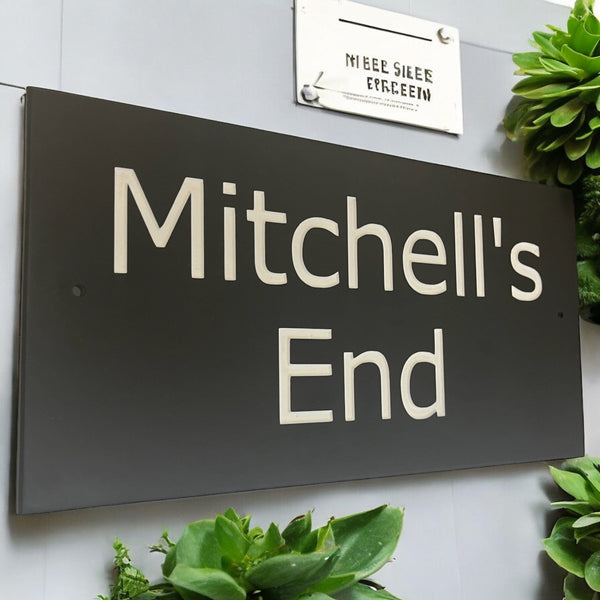 Introducing our stunning 41cm x 22.5cm Polished Natural Slate House Sign, designed to make a lasting impression! Crafted with durability in mind, it features beautifully carved lettering that enhances its elegance and visibility. Transform your home's entrance with this exquisite sign! www.HouseSign.co.uk