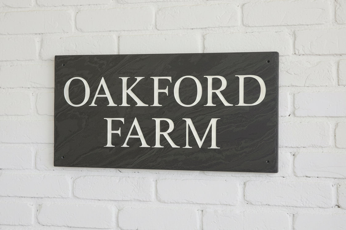 Introducing our stunning 41cm x 22.5cm Polished Natural Slate House Sign, designed to make a lasting impression! Crafted with durability in mind, it features beautifully carved lettering that enhances its elegance and visibility. Transform your home's entrance with this exquisite sign! www.HouseSign.co.uk