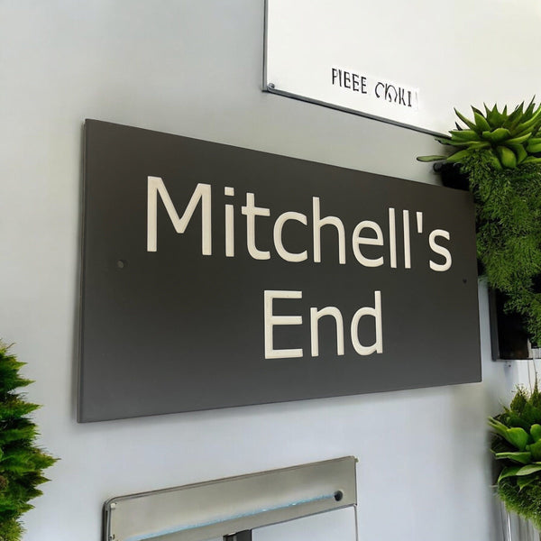 Introducing our stunning 41cm x 22.5cm Polished Natural Slate House Sign, designed to make a lasting impression! Crafted with durability in mind, it features beautifully carved lettering that enhances its elegance and visibility. Transform your home's entrance with this exquisite sign! www.HouseSign.co.uk