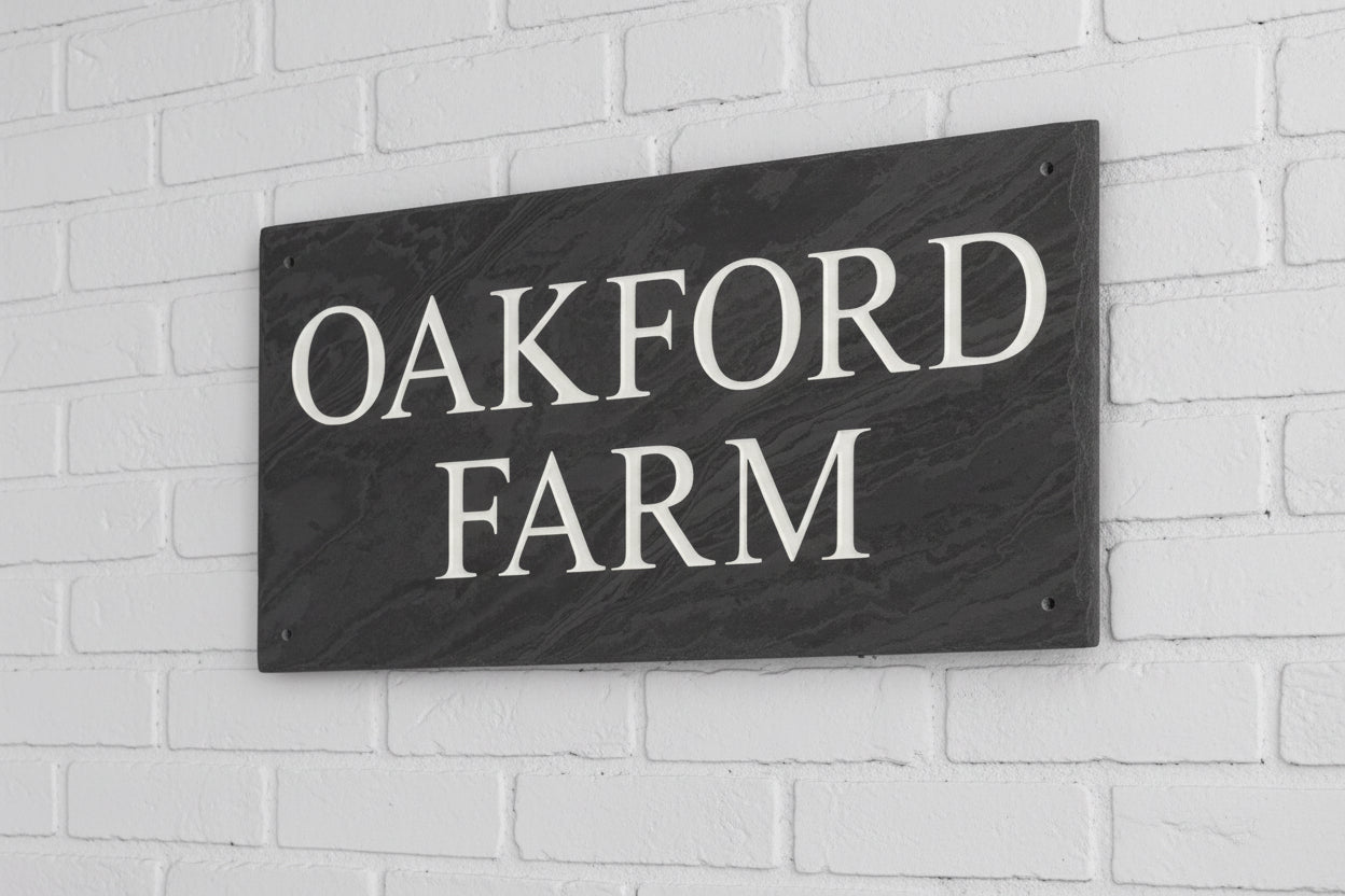 Introducing our stunning 41cm x 22.5cm Polished Natural Slate House Sign, designed to make a lasting impression! Crafted with durability in mind, it features beautifully carved lettering that enhances its elegance and visibility. Transform your home's entrance with this exquisite sign! www.HouseSign.co.uk