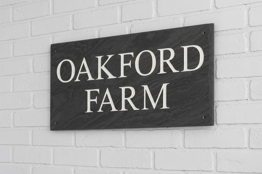 Introducing our stunning 41cm x 22.5cm Polished Natural Slate House Sign, designed to make a lasting impression! Crafted with durability in mind, it features beautifully carved lettering that enhances its elegance and visibility. Transform your home's entrance with this exquisite sign! www.HouseSign.co.uk