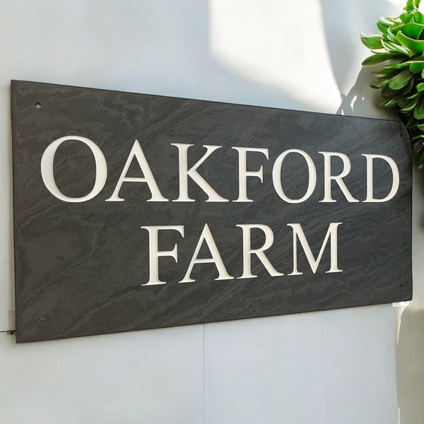 Introducing our stunning 41cm x 22.5cm Polished Natural Slate House Sign, designed to make a lasting impression! Crafted with durability in mind, it features beautifully carved lettering that enhances its elegance and visibility. Transform your home's entrance with this exquisite sign! www.HouseSign.co.uk