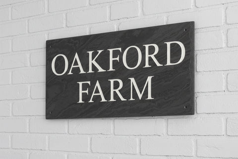 Introducing our stunning 41cm x 22.5cm Polished Natural Slate House Sign, designed to make a lasting impression! Crafted with durability in mind, it features beautifully carved lettering that enhances its elegance and visibility. Transform your home's entrance with this exquisite sign! www.HouseSign.co.uk