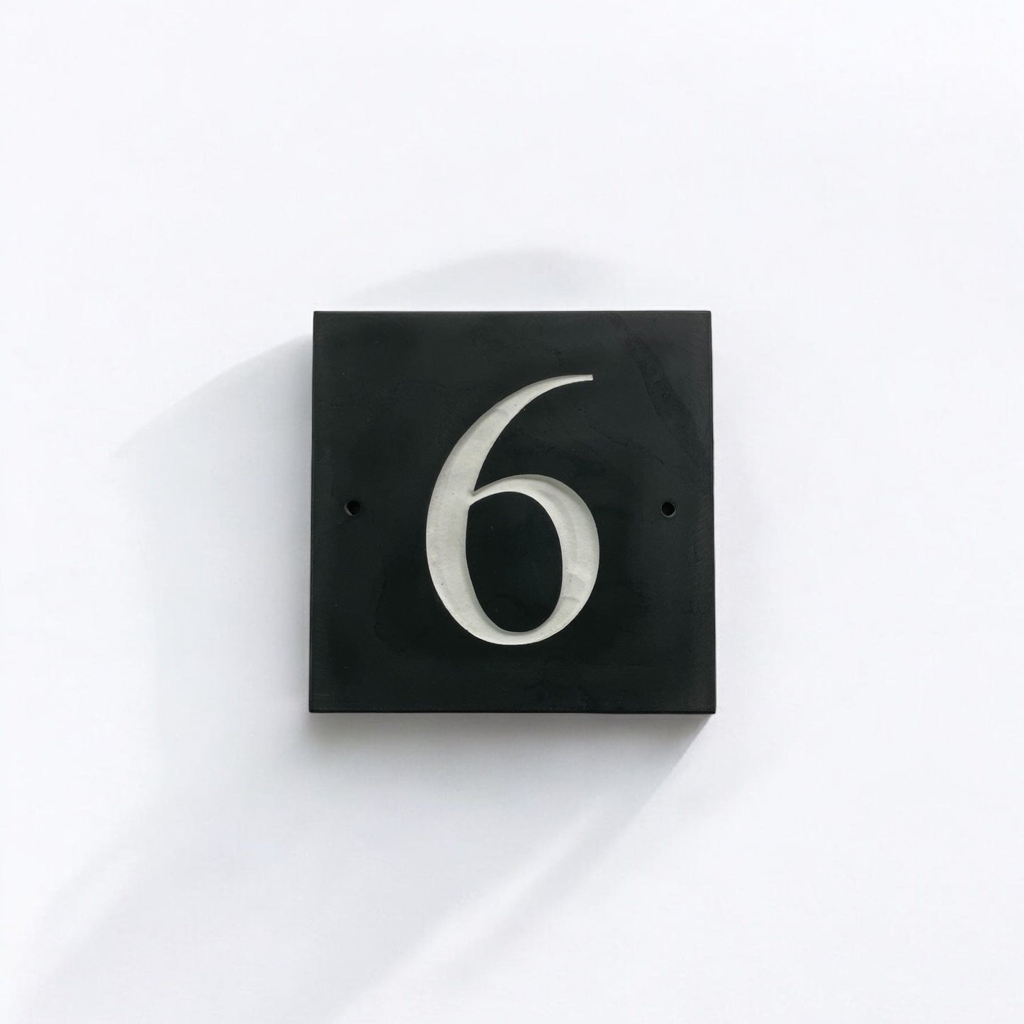 Introducing our stunning 10cm x 10cm Polished Natural Slate House Sign, designed to make a lasting impression! Crafted with durability in mind, it features beautifully carved lettering that enhances its elegance and visibility. Transform your home's entrance with this exquisite sign! www.HouseSign.co.uk