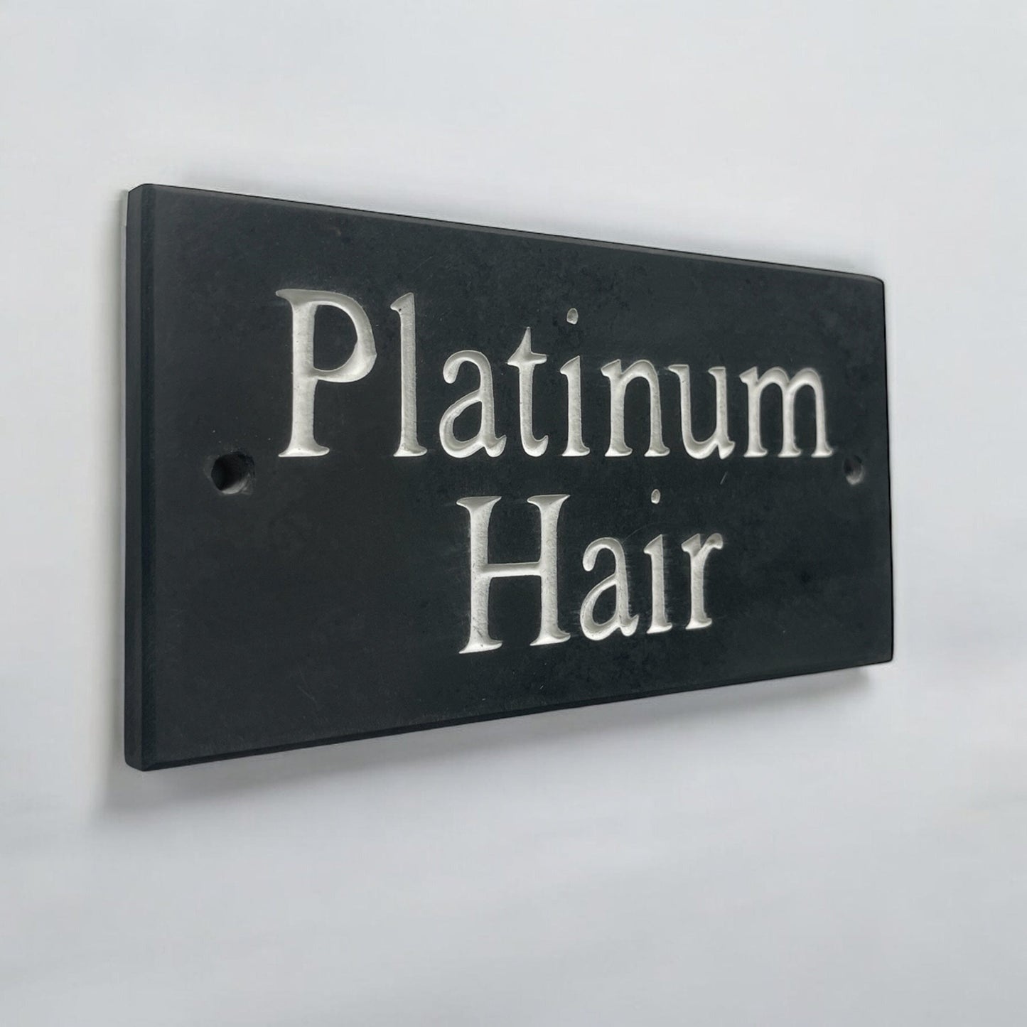 Introducing our stunning 15cm x 7.5cm Polished Natural Slate House Sign, designed to make a lasting impression! Crafted with durability in mind, it features beautifully carved lettering that enhances its elegance and visibility. Transform your home's entrance with this exquisite sign! www.HouseSign.co.uk