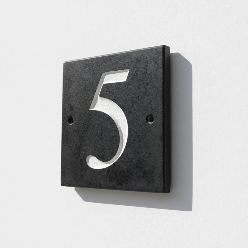 Introducing our stunning 15cm x 15cm Polished Natural Slate House Sign, designed to make a lasting impression! Crafted with durability in mind, it features beautifully carved lettering that enhances its elegance and visibility. Transform your home's entrance with this exquisite sign! www.HouseSign.co.uk