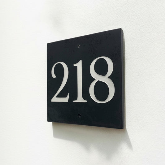Introducing our stunning 15cm x 15cm Polished Natural Slate House Sign, designed to make a lasting impression! Crafted with durability in mind, it features beautifully carved lettering that enhances its elegance and visibility. Transform your home's entrance with this exquisite sign! www.HouseSign.co.uk