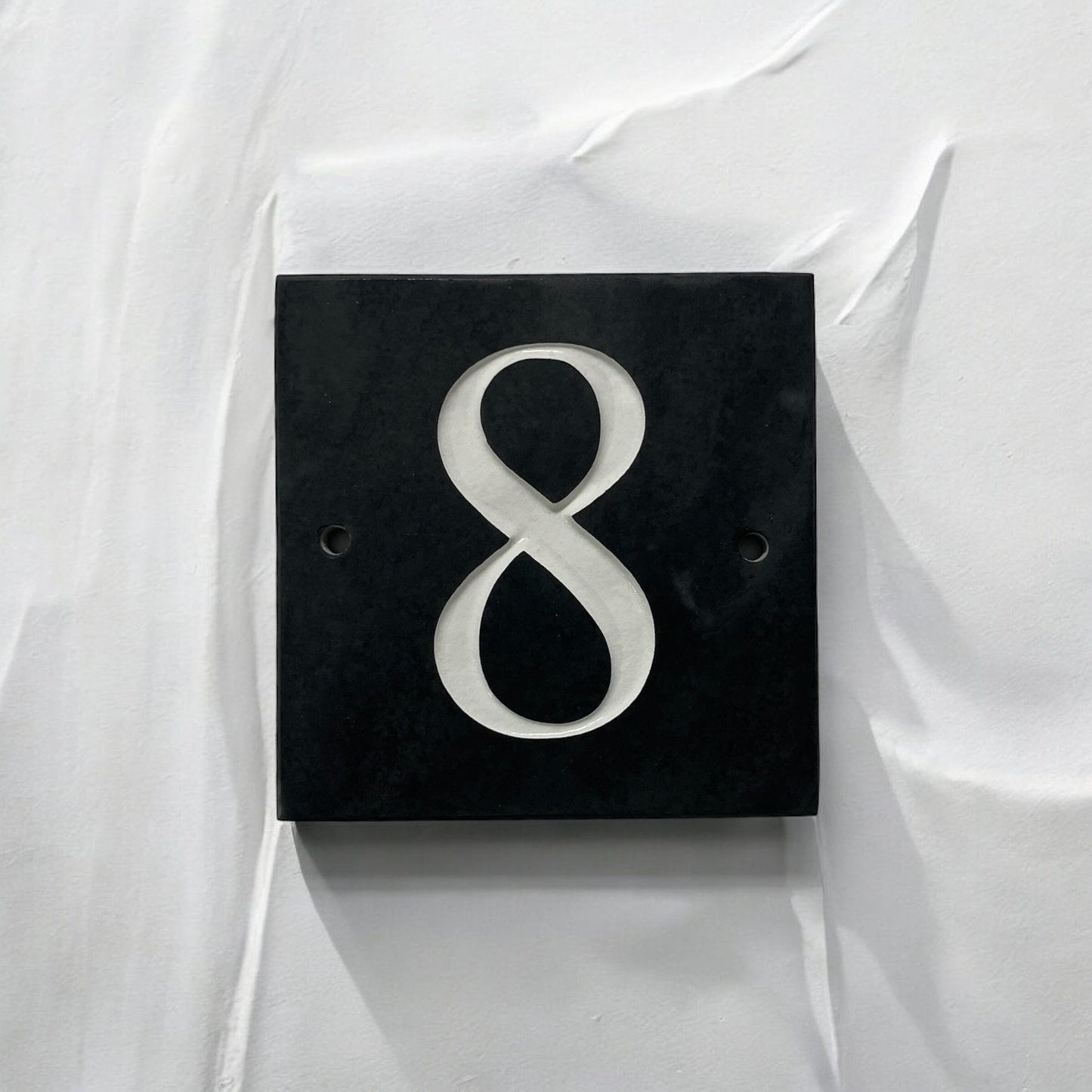 Introducing our stunning 15cm x 15cm Polished Natural Slate House Sign, designed to make a lasting impression! Crafted with durability in mind, it features beautifully carved lettering that enhances its elegance and visibility. Transform your home's entrance with this exquisite sign! www.HouseSign.co.uk