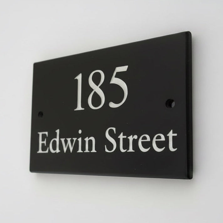 Introducing our stunning 20cm x 10cm Polished Natural Slate House Sign, designed to make a lasting impression! Crafted with durability in mind, it features beautifully carved lettering that enhances its elegance and visibility. Transform your home's entrance with this exquisite sign! www.HouseSign.co.uk
