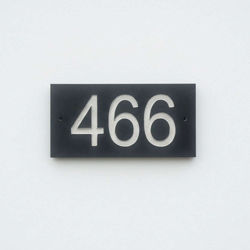 Introducing our stunning 20cm x 10cm Polished Natural Slate House Sign, designed to make a lasting impression! Crafted with durability in mind, it features beautifully carved lettering that enhances its elegance and visibility. Transform your home's entrance with this exquisite sign! www.HouseSign.co.uk