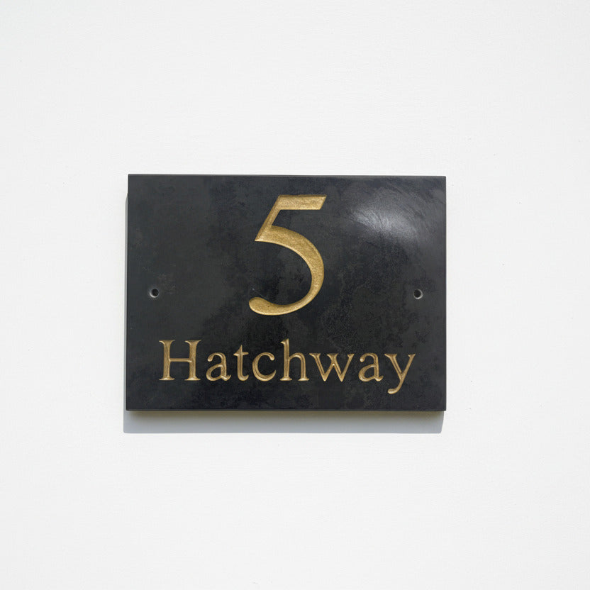 Introducing our stunning 20cm x 15cm Polished Natural Slate House Sign, designed to make a lasting impression! Crafted with durability in mind, it features beautifully carved lettering that enhances its elegance and visibility. Transform your home's entrance with this exquisite sign! www.HouseSign.co.uk