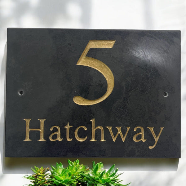 Introducing our stunning 20cm x 15cm Polished Natural Slate House Sign, designed to make a lasting impression! Crafted with durability in mind, it features beautifully carved lettering that enhances its elegance and visibility. Transform your home's entrance with this exquisite sign! www.HouseSign.co.uk