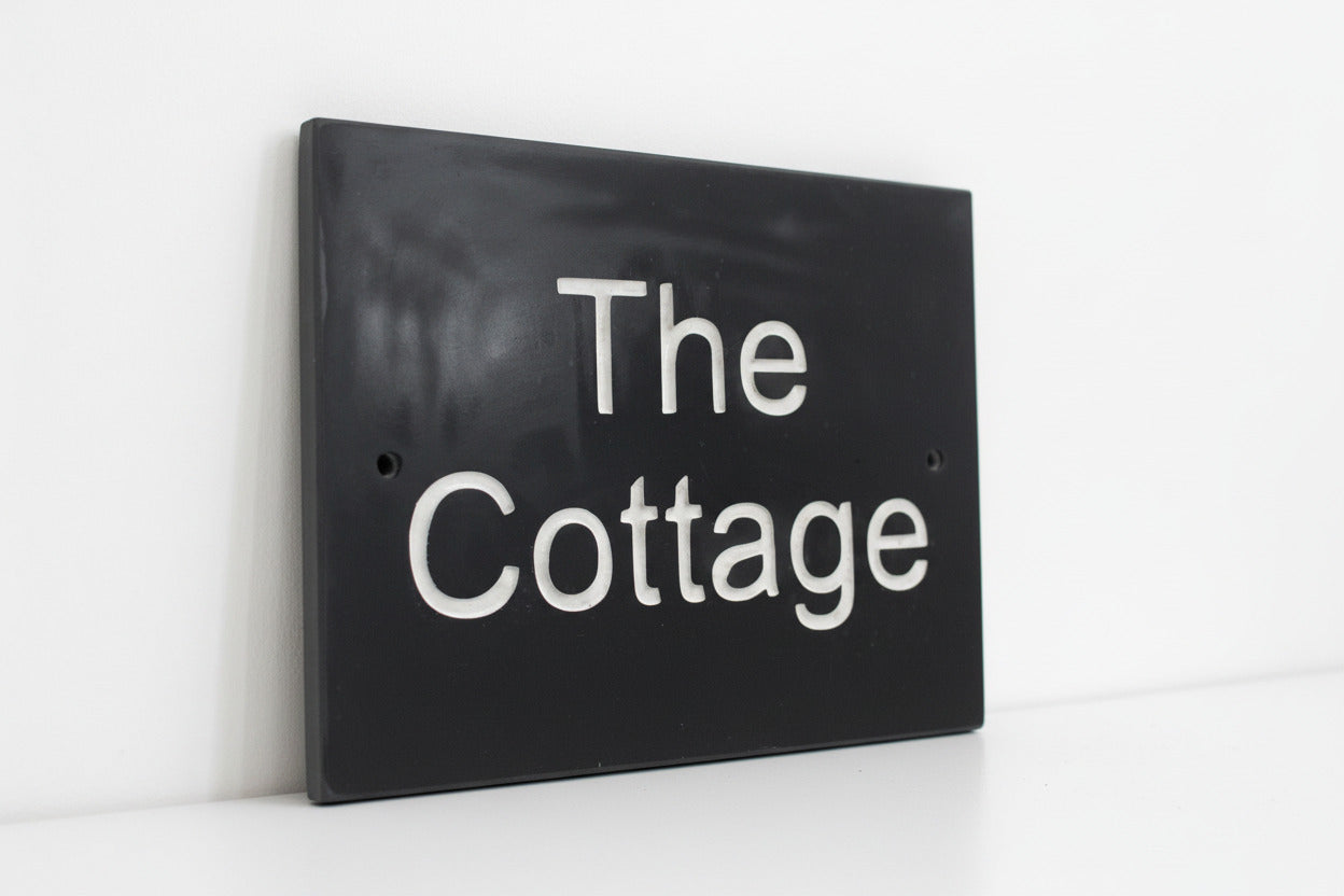 Introducing our stunning 20cm x 15cm Polished Natural Slate House Sign, designed to make a lasting impression! Crafted with durability in mind, it features beautifully carved lettering that enhances its elegance and visibility. Transform your home's entrance with this exquisite sign! www.HouseSign.co.uk