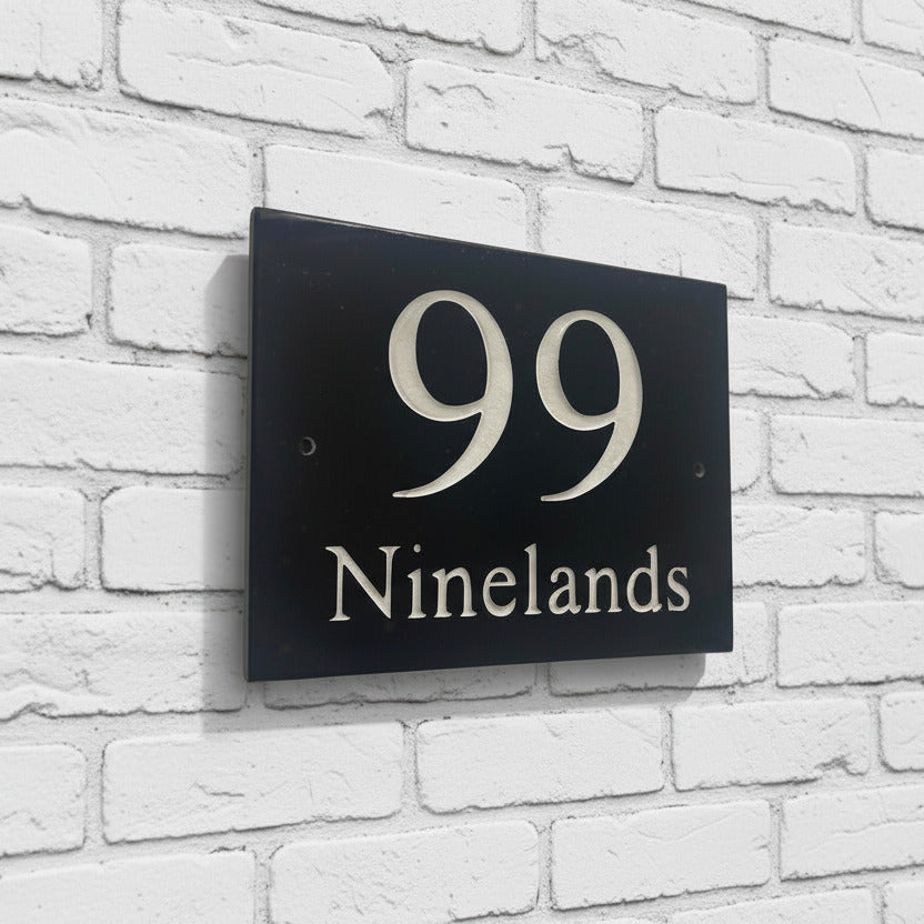 Introducing our stunning 20cm x 15cm Polished Natural Slate House Sign, designed to make a lasting impression! Crafted with durability in mind, it features beautifully carved lettering that enhances its elegance and visibility. Transform your home's entrance with this exquisite sign! www.HouseSign.co.uk
