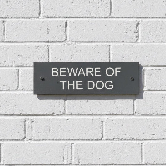 A Beware Of The Dog Gate Sign made in Natural Slate with polished edges and hard-wearing carved lettering www.HouseSign.co.uk