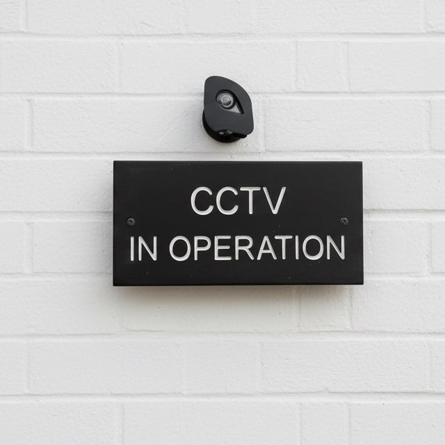 A CCTV Gate Or Wall Sign made in Natural Slate with polished edges and hard-wearing carved lettering www.HouseSign.co.uk