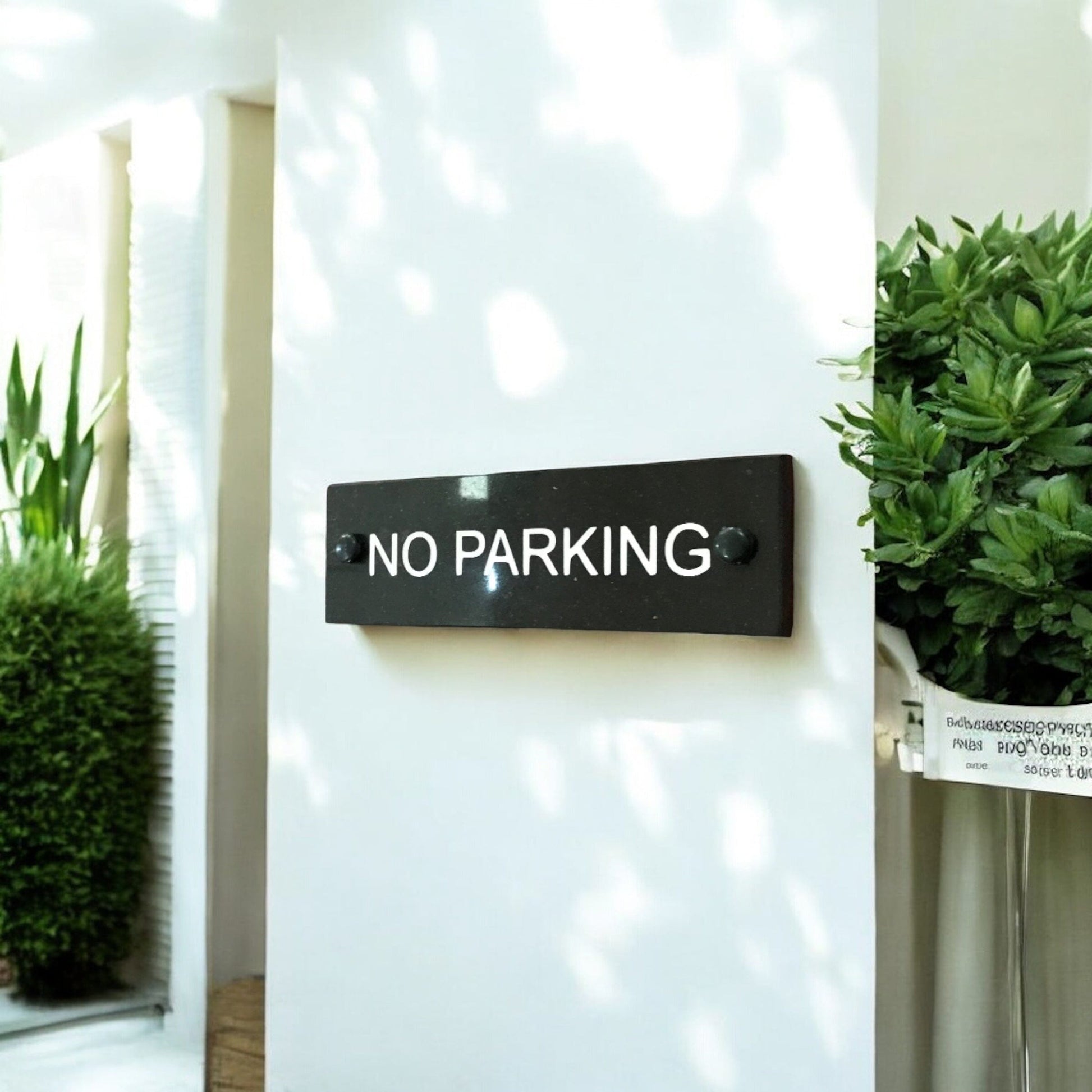 A No Parking Sign made in Natural Slate with polished edges and hard-wearing carved lettering www.HouseSign.co.uk