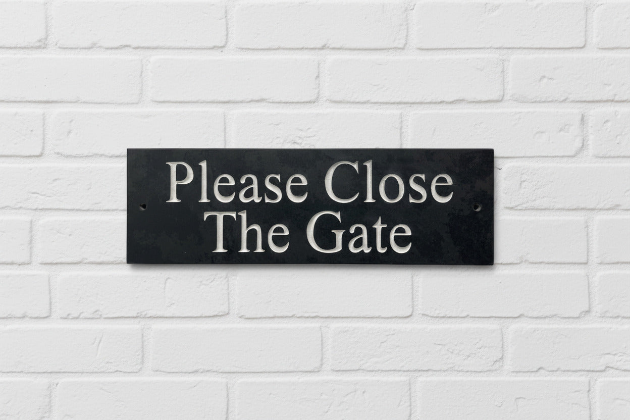 A Please Close The Gate Sign made in Natural Slate with polished edges and hard-wearing carved lettering www.HouseSign.co.uk