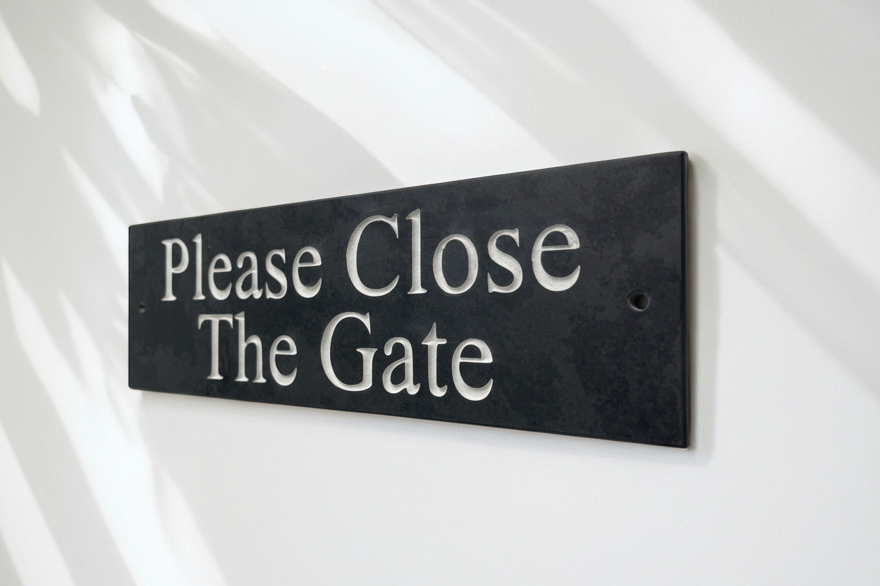 A Please Close The Gate Sign made in Natural Slate with polished edges and hard-wearing carved lettering www.HouseSign.co.uk