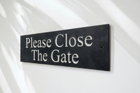 A Please Close The Gate Sign made in Natural Slate with polished edges and hard-wearing carved lettering www.HouseSign.co.uk