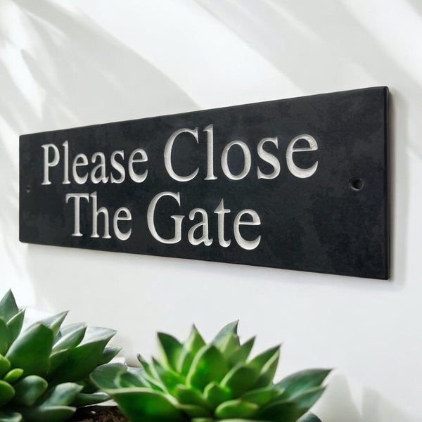 A Please Close The Gate Sign made in Natural Slate with polished edges and hard-wearing carved lettering www.HouseSign.co.uk