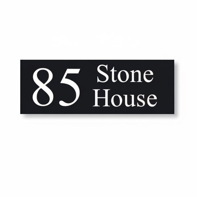 A black square House Sign with clear deep-cut numbers featuring a green plant placed elegantly on its surface www.HouseSign.co.uk 