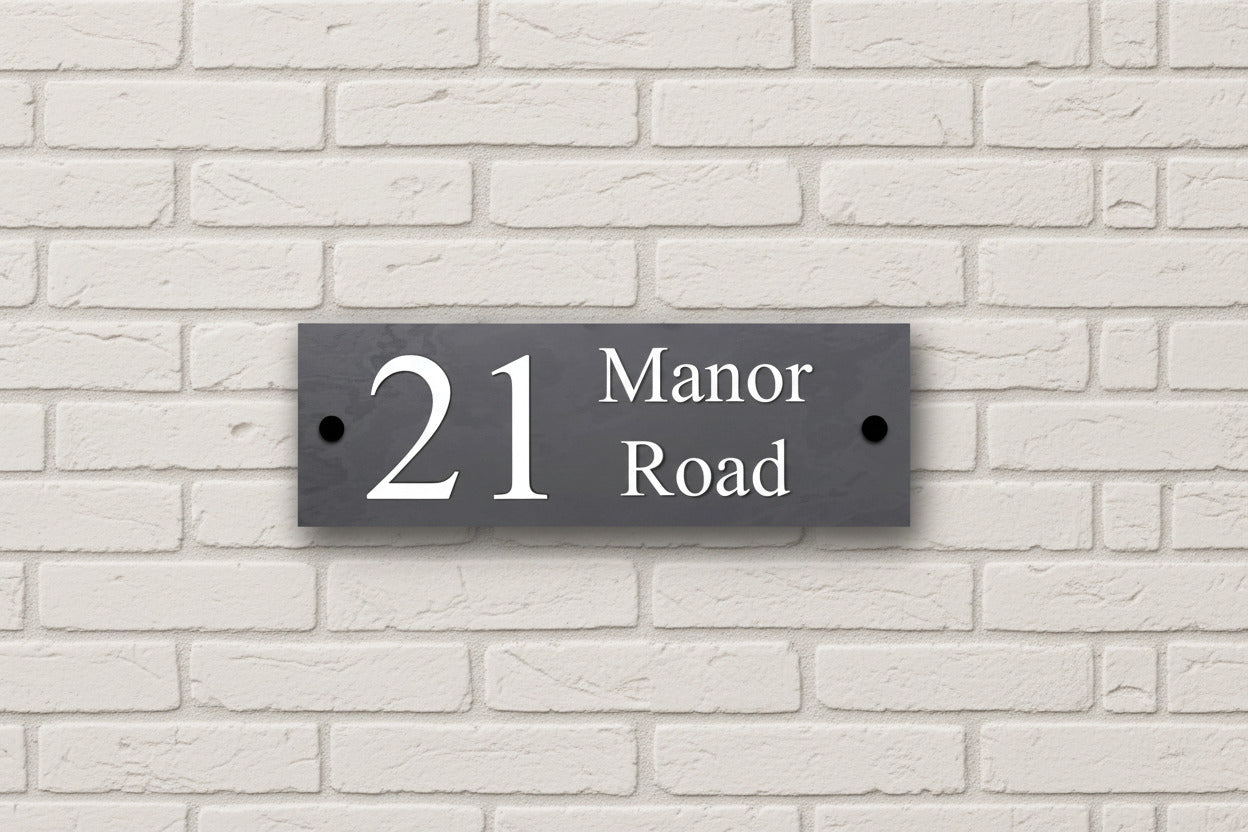 Introducing our stunning 30cm x 10cm Polished Natural Slate House Sign, designed to make a lasting impression! Crafted with durability in mind, it features beautifully carved lettering that enhances its elegance and visibility. Transform your home's entrance with this exquisite sign! www.HouseSign.co.uk
